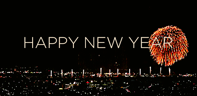 happy-new-year-colorful-fireworks-over-city-animated-gif